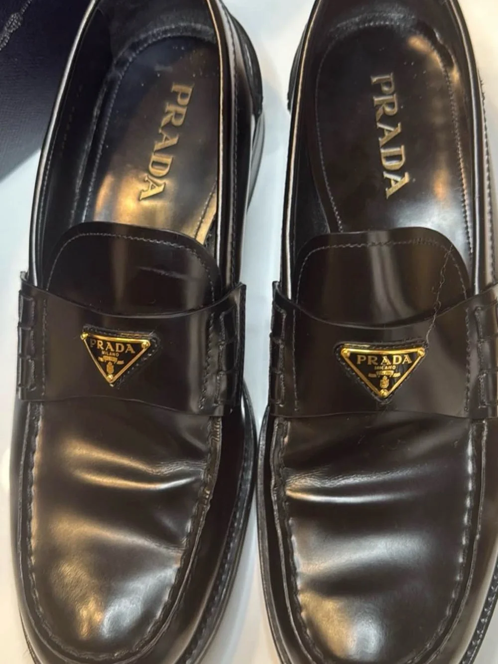 Prada Black Leather Men's Slip-On Loafers with Gold Logo